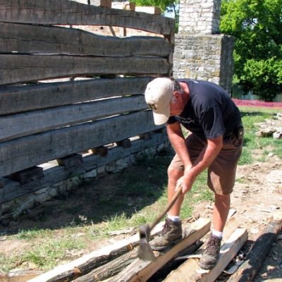 Worker using period tools to built the new Zumwalt's Fort
