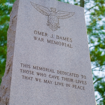 The top of the memorial inscribed with a dedication.