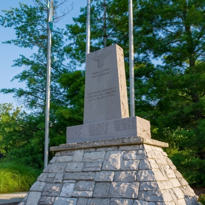 The Omer J. Dames War Memorial, flags and dedication stones.