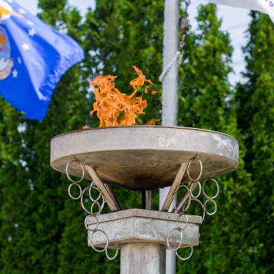 An eternal flame burns brightly to symbolize our nation's perpetual gratitude towards our fallen heroes.