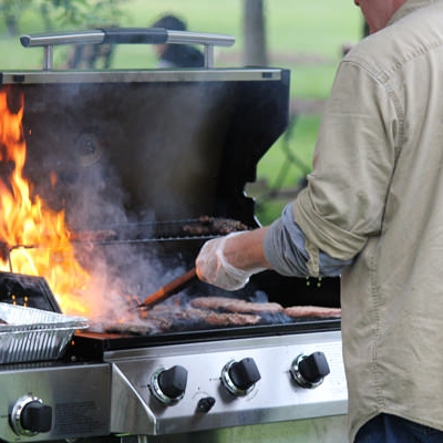 Open flames of vendor grilling meats