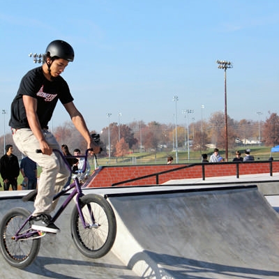 BMX biker gets ready to do a trick at Westhoff Plaza